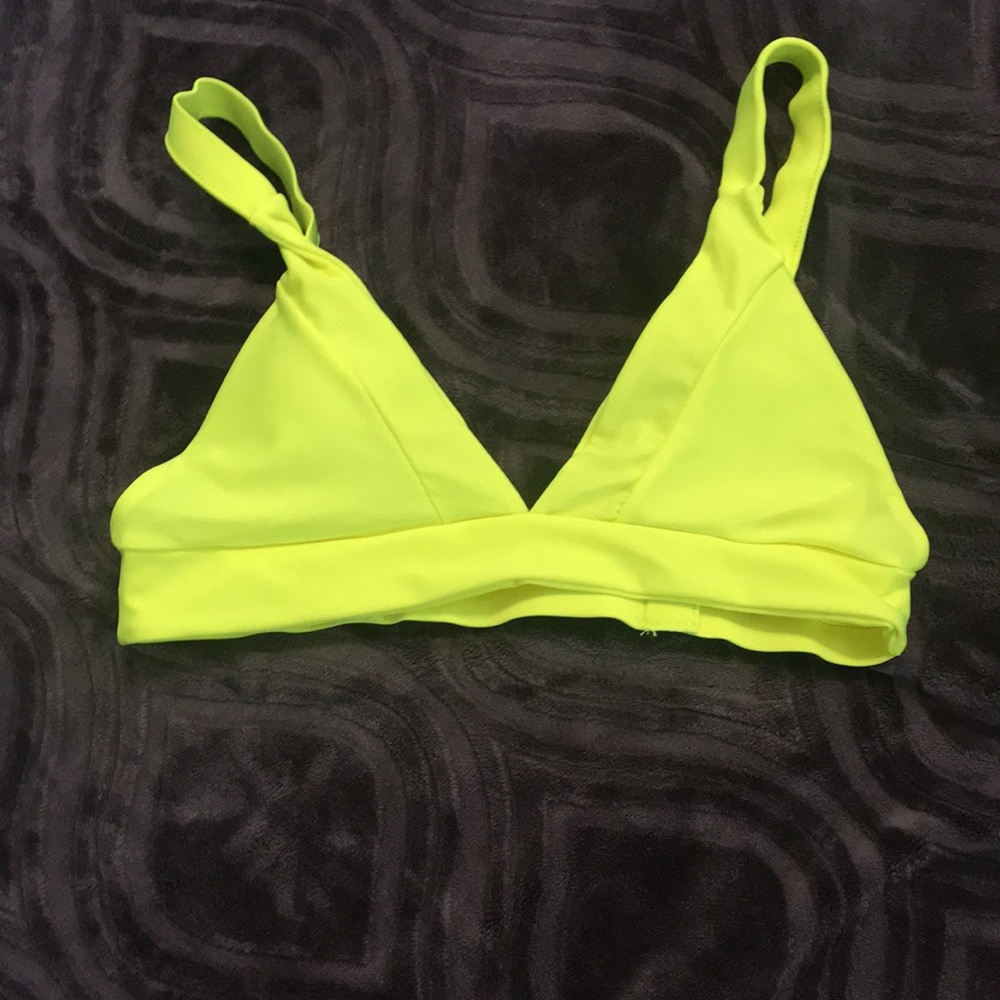 A neon yellow swimsuit top